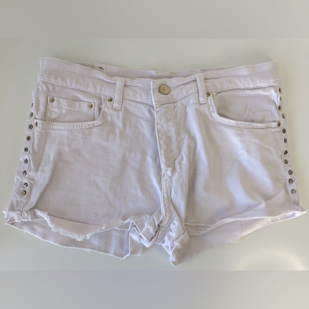 Powder, pink colored jean shorts with studs